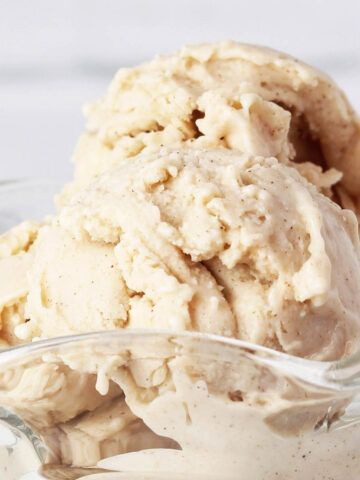 close of view of scoops of cinnamon protein frozen yogurt in a glass ice cream dish