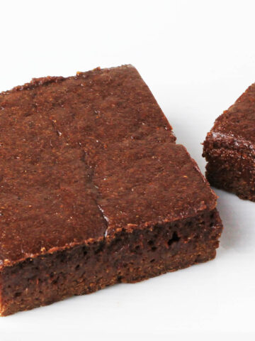 close up of a protein brownie on a white plate
