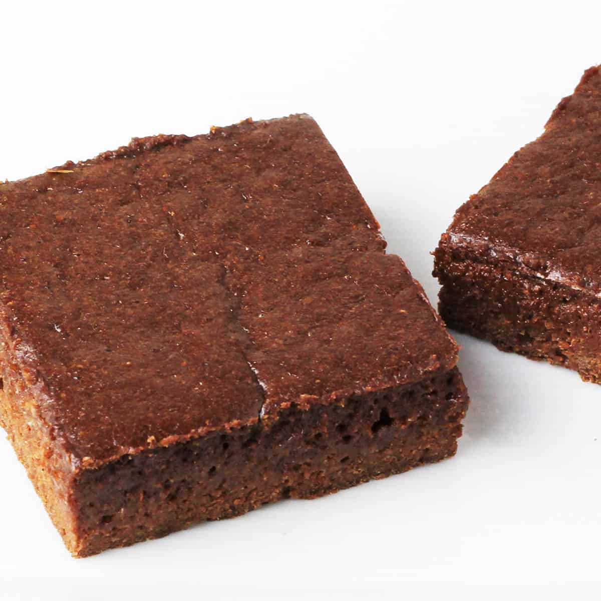 close up of a protein brownie on a white plate