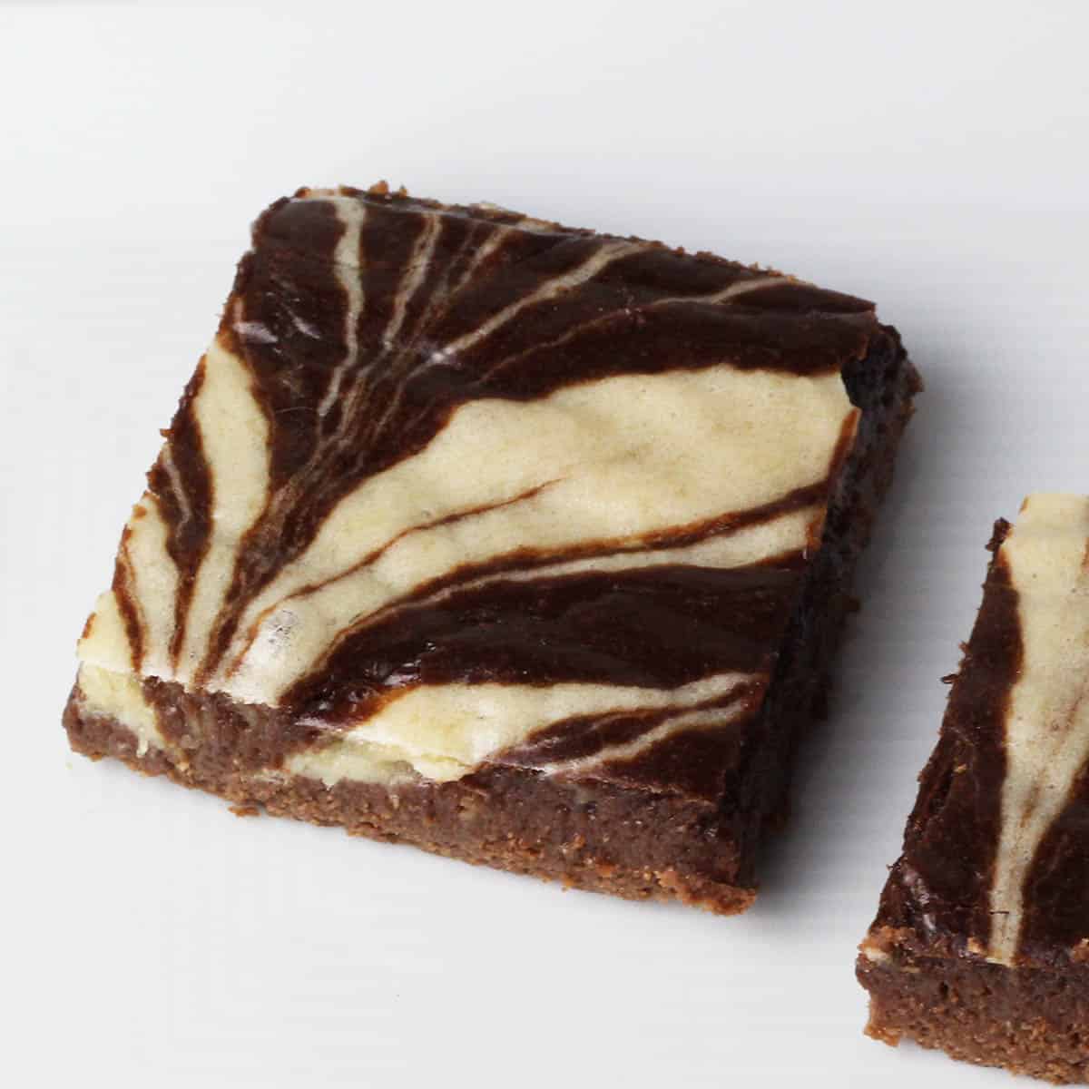 top view of one peppermint swirl brownie on a white plate