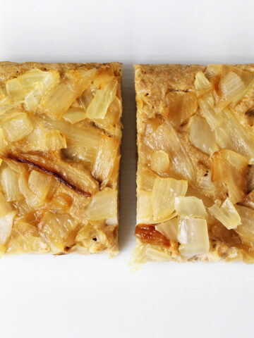 top view of two pieces of protein focaccia bread topped with caramelized onions