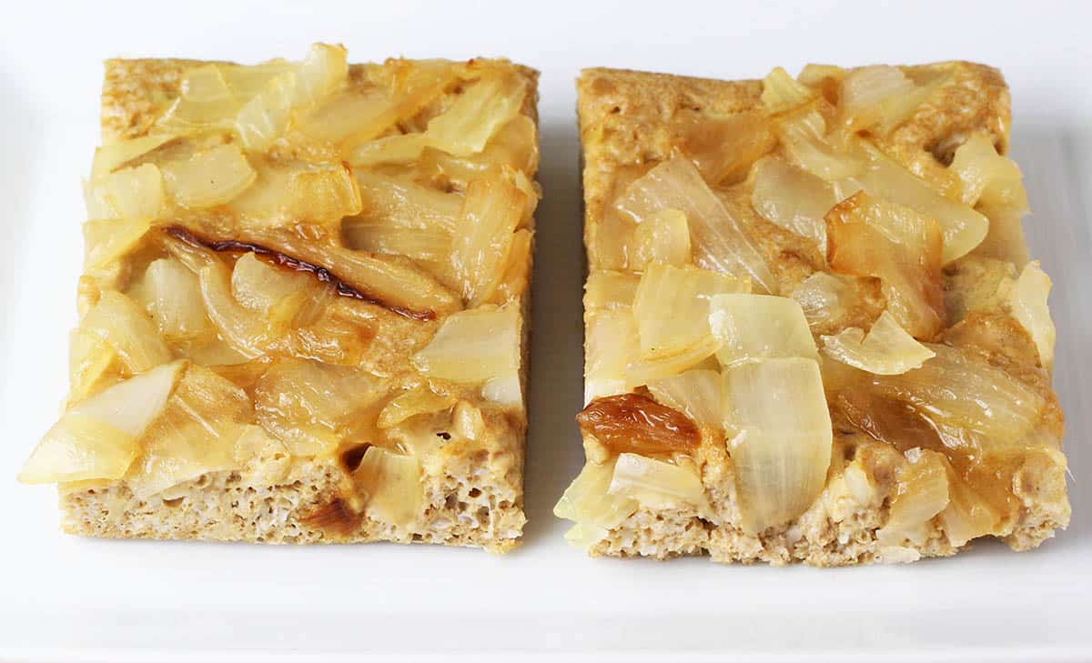 two pieces of protein focaccia bread topped with caramelized onions