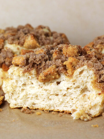 individual coffee cakes with the one in front sliced open