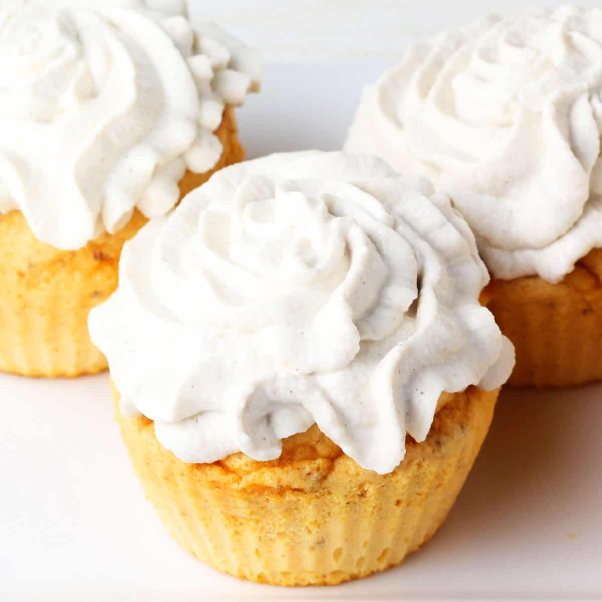 three frosted healthy sweet potato cupcakes