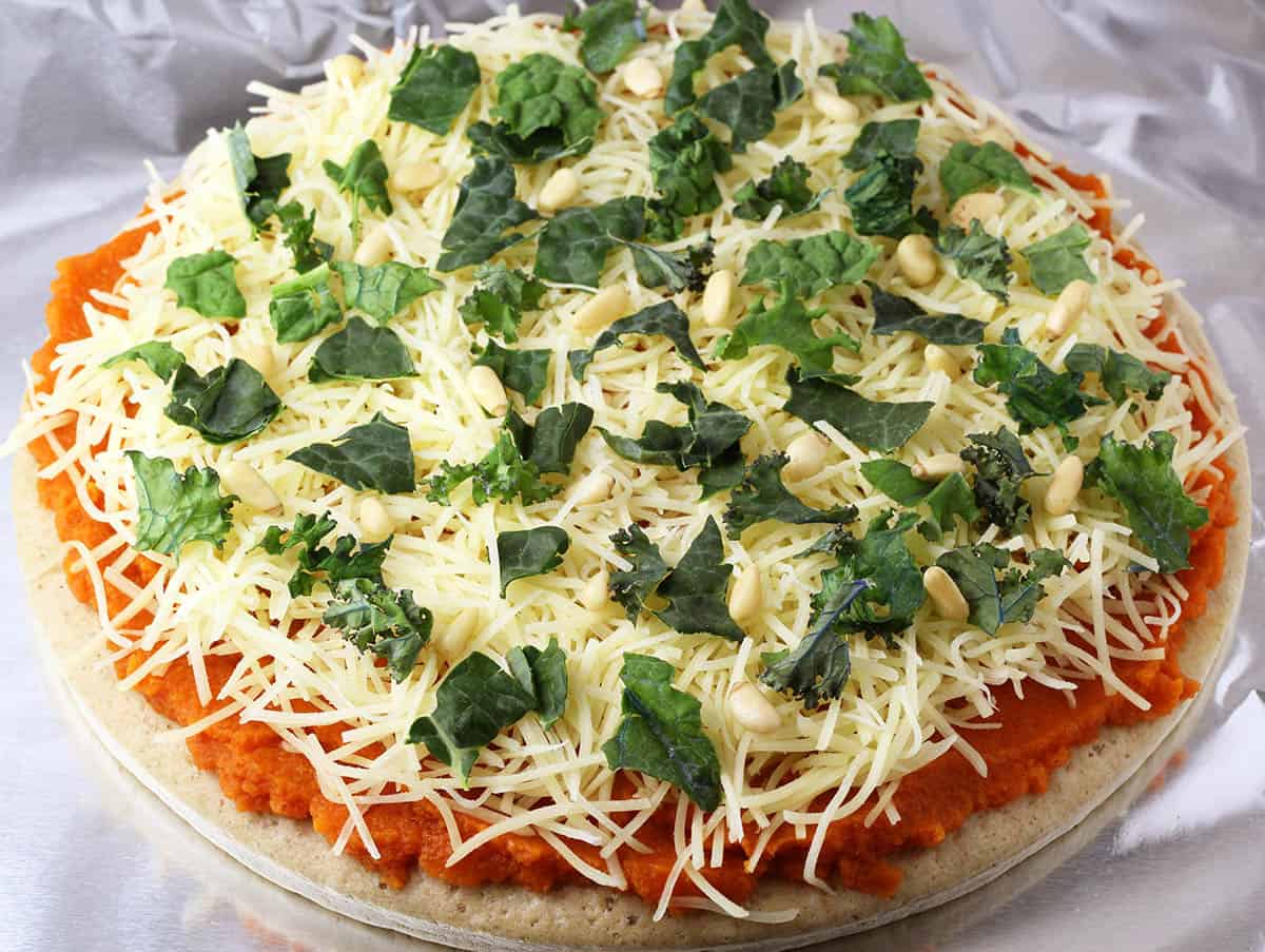 unbaked whole pumpkin kale pizza