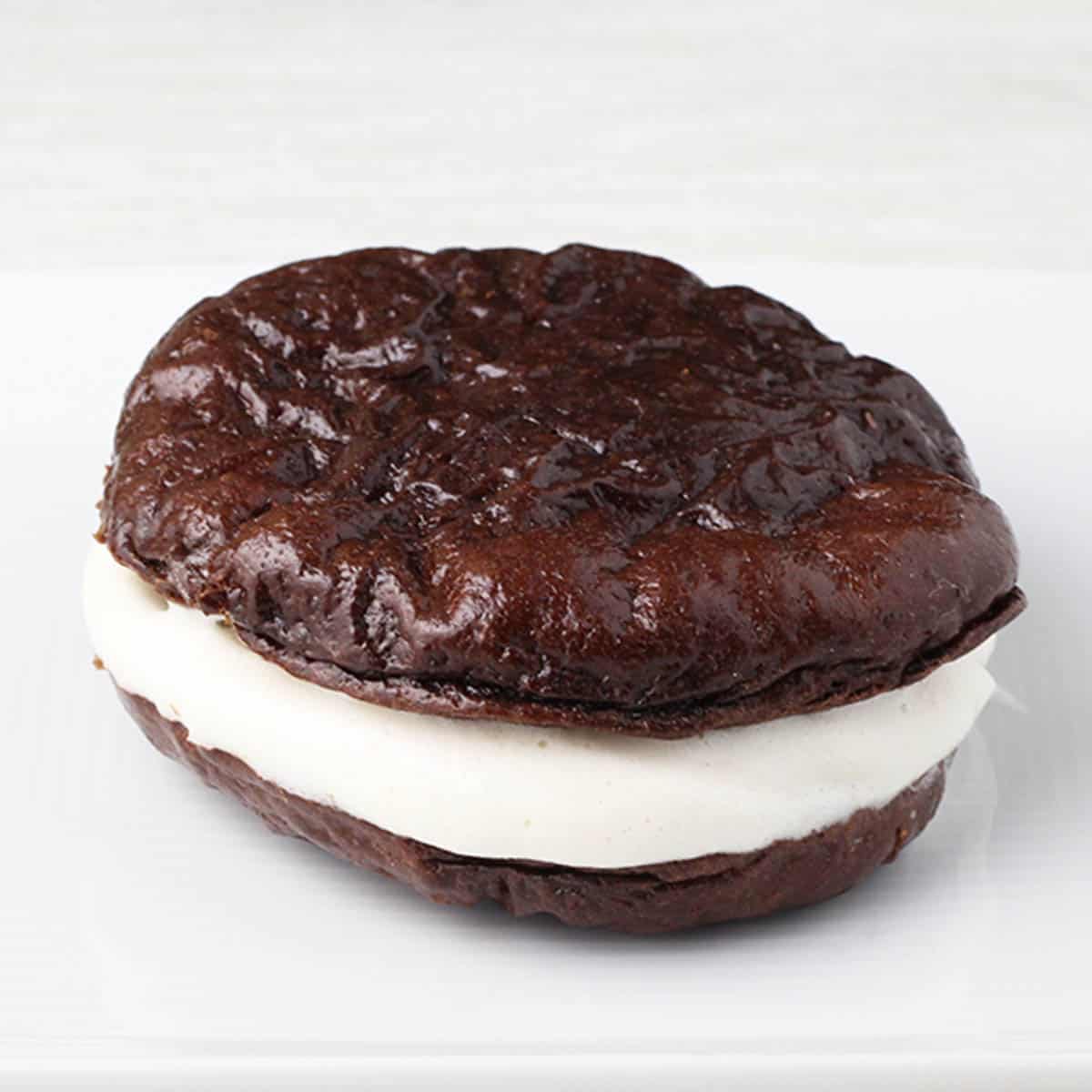 a chocolate whoopie pie on a white plate