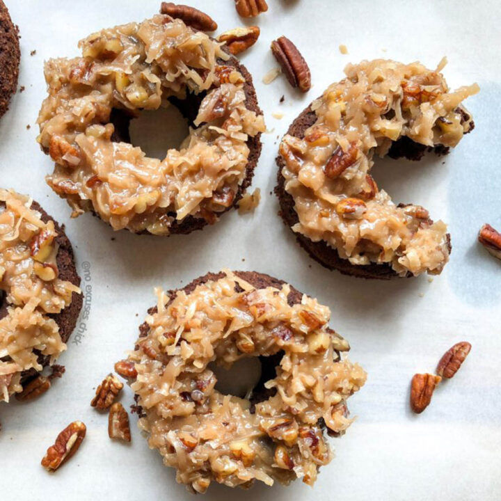 a few chocolate donuts topped with german chocolate cake topping