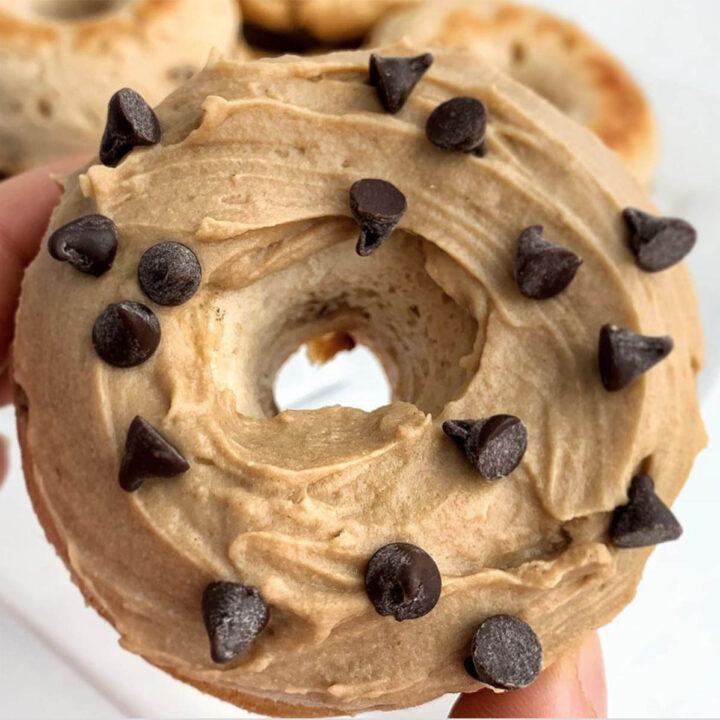 top view of a donut frosted with cookie butter and topped with chocolate chips