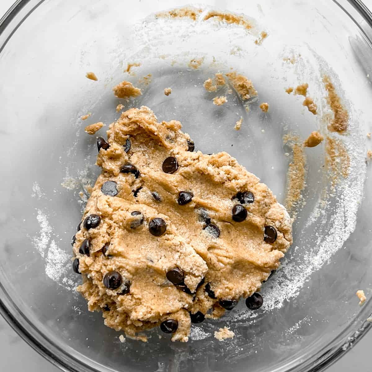 bowl with prepared chocolate chip protein cookie dough