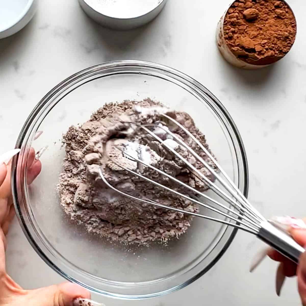 bowl with whey protein and sweetener being mixed with a whisk