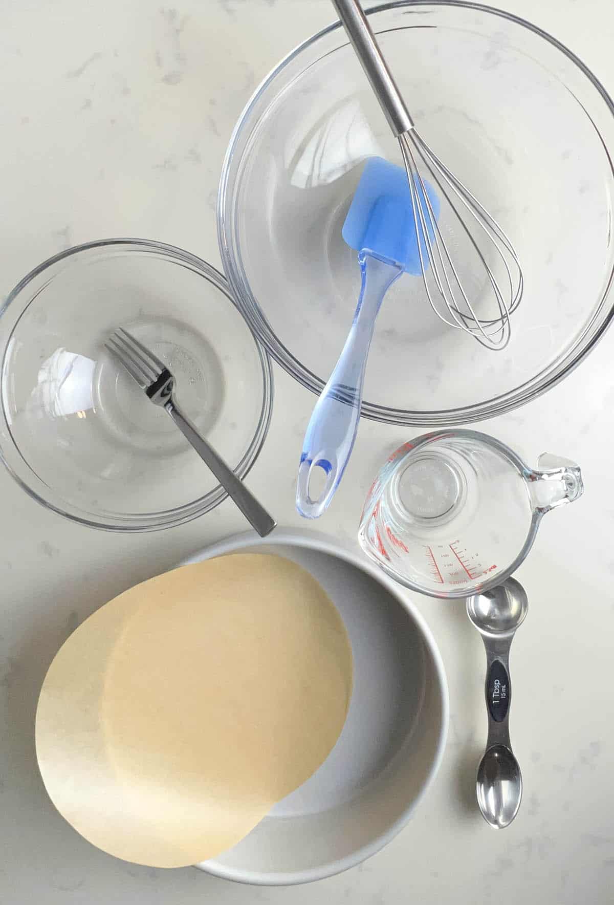 mixing bowls, cake pan, and utensils