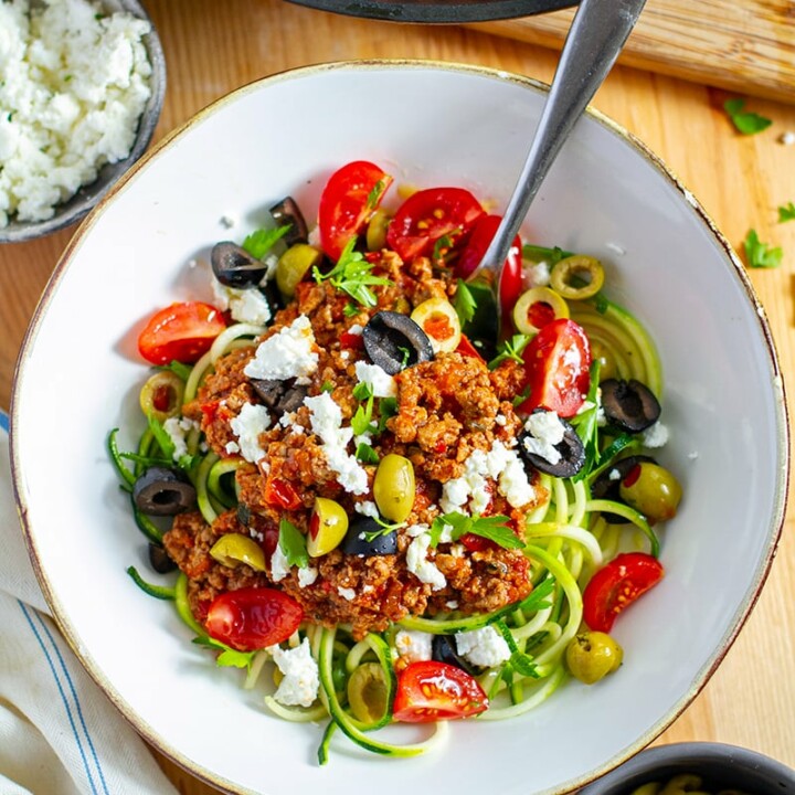 bowl of greek turkey bolognese with a spoon in it