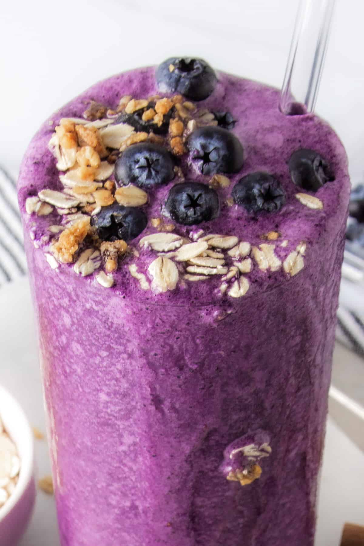 blueberry muffin protein shake topped with blueberries.