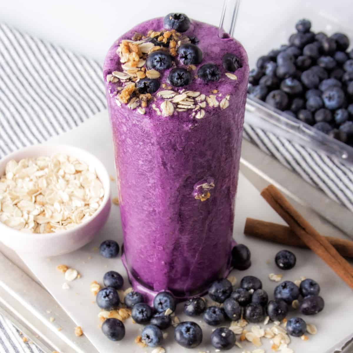 blueberry protein shake topped with blueberries.