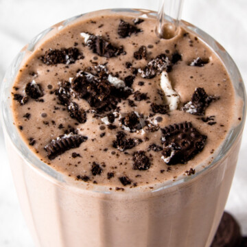 oreo protein shake topped with crushed oreos.