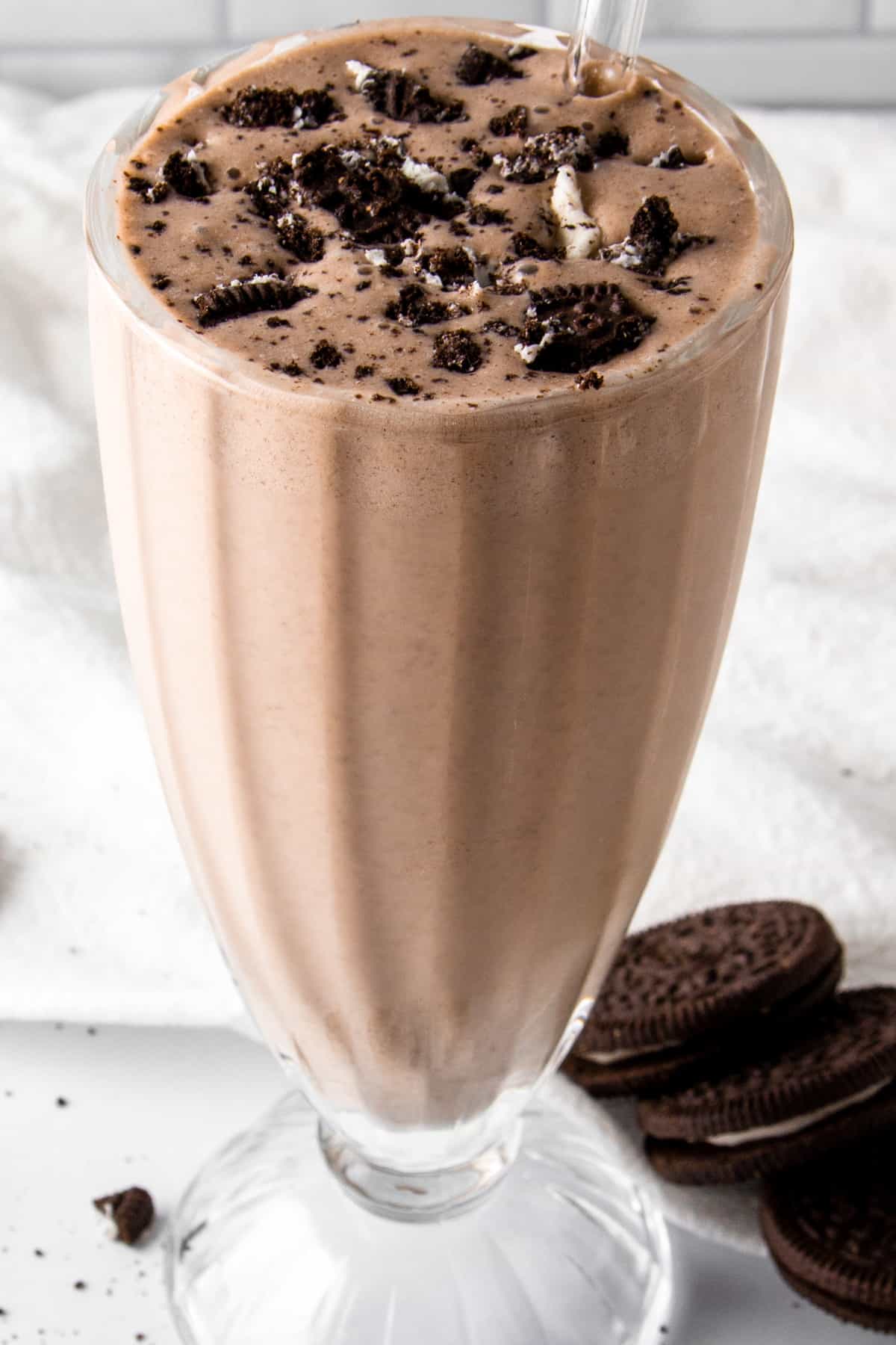 oreo protein shake topped with crushed oreos.