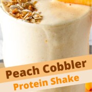 peach cobbler protein shake with text overlay.