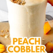 peach cobbler protein shake with text overlay.