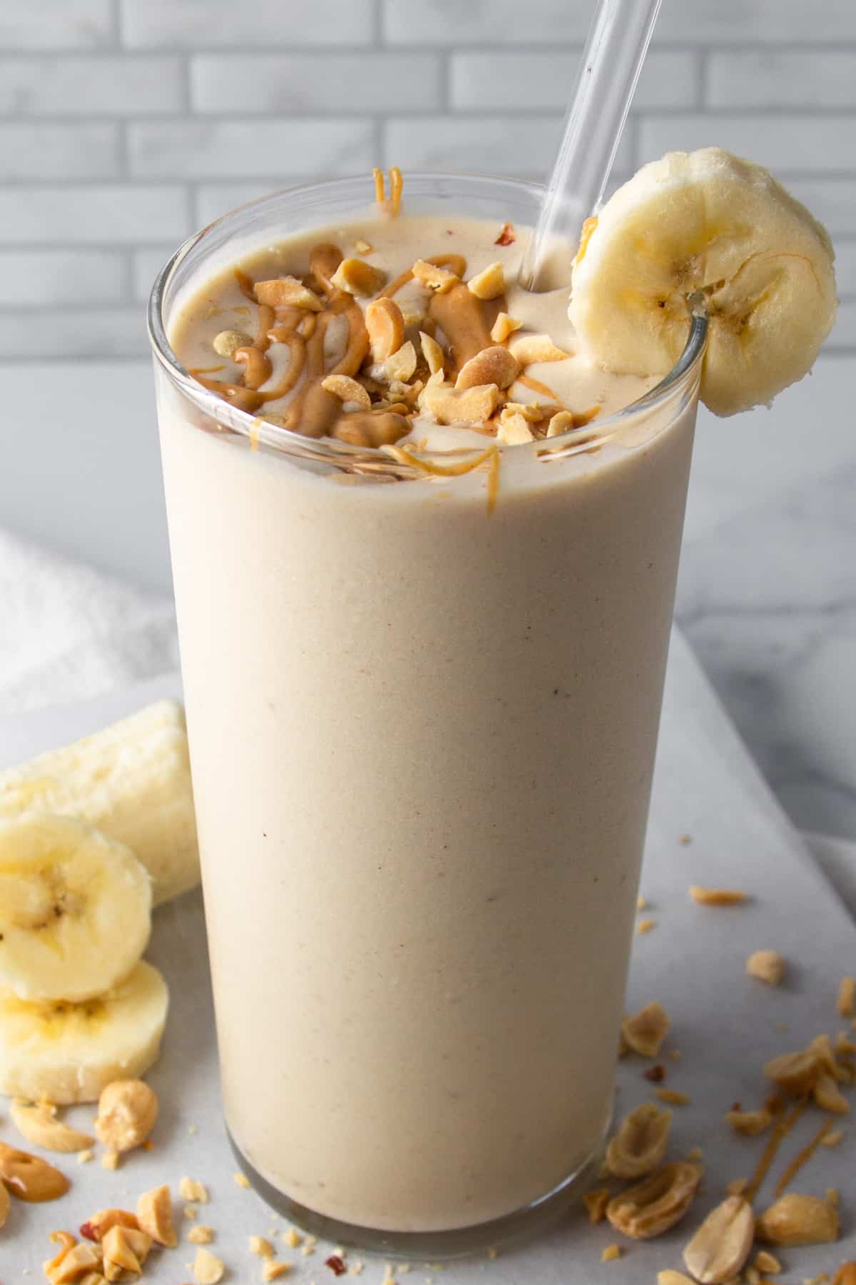 banana peanut butter shake in a glass.