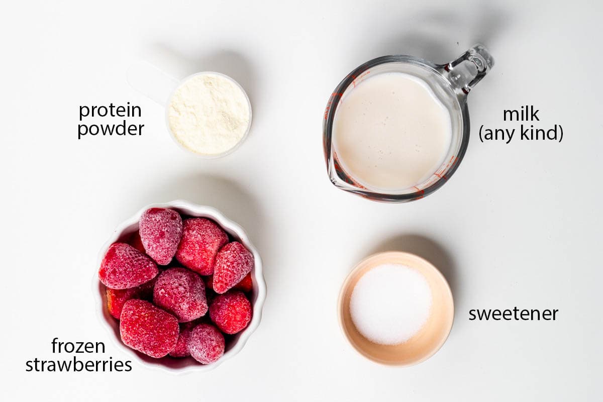 labeled photo of ingredients for this strawberry protein shake.