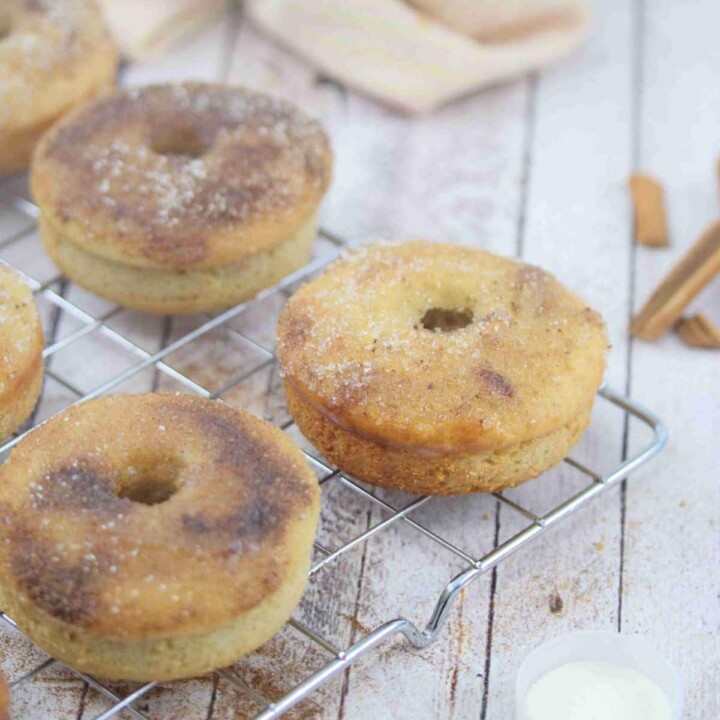 cinnamon sugar donuts on a cooling rack.