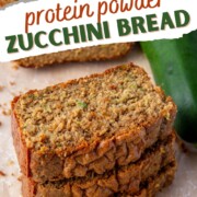 the stacked slices of high protein zucchini bread next to a zucchini, with text overlay.