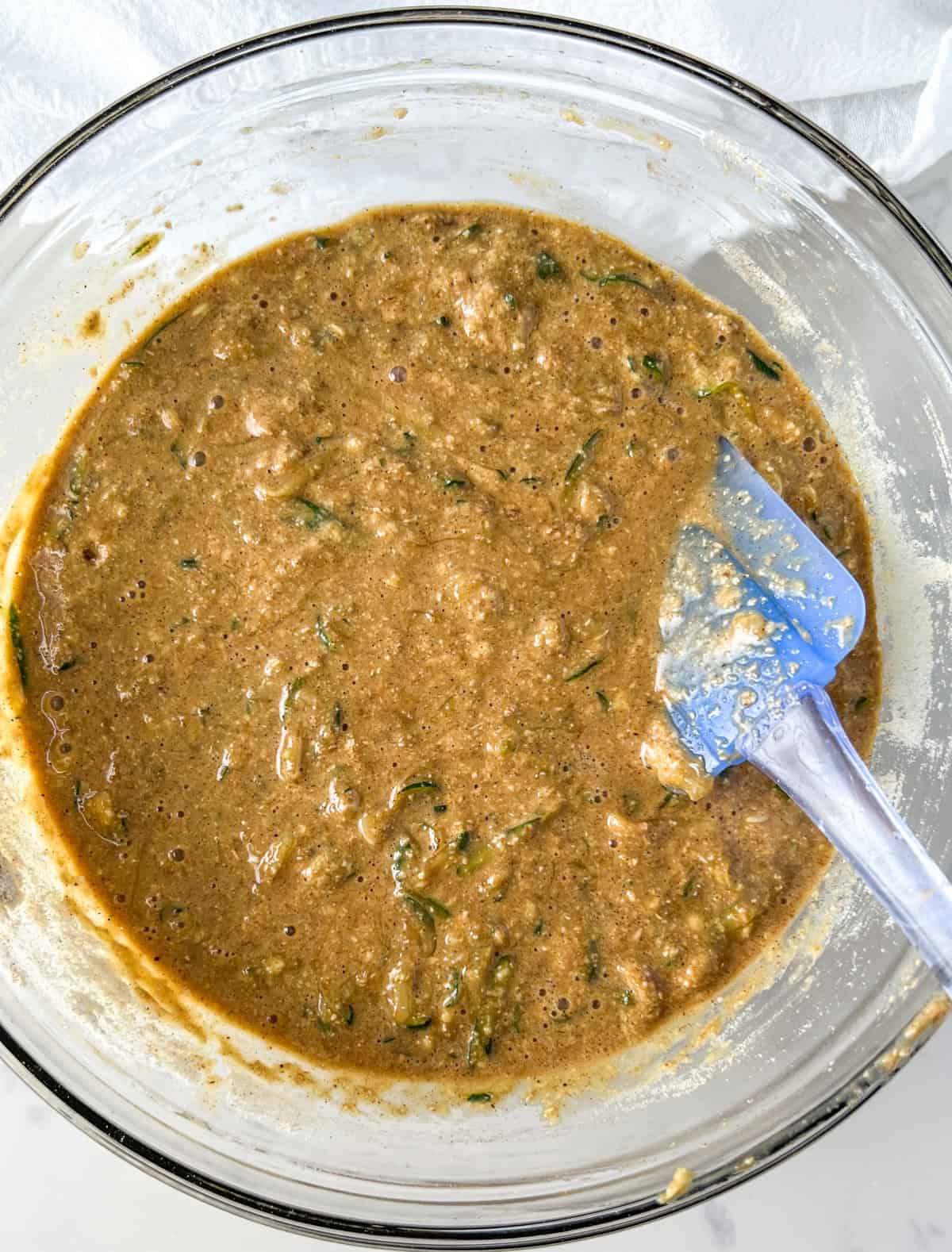 protein zucchini bread batter in a glass bowl.