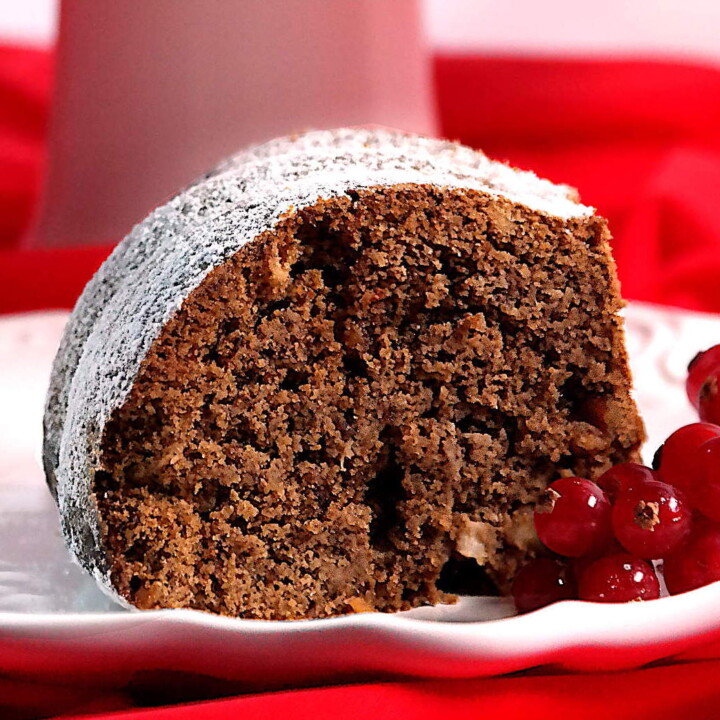 slice of gingerbread protein cake with berries.