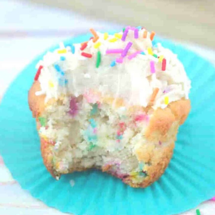 confetti protein cupcake with frosting and sprinkles.