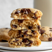 stack of high protein chocolate chip cookie halves with melty chocolate chips.