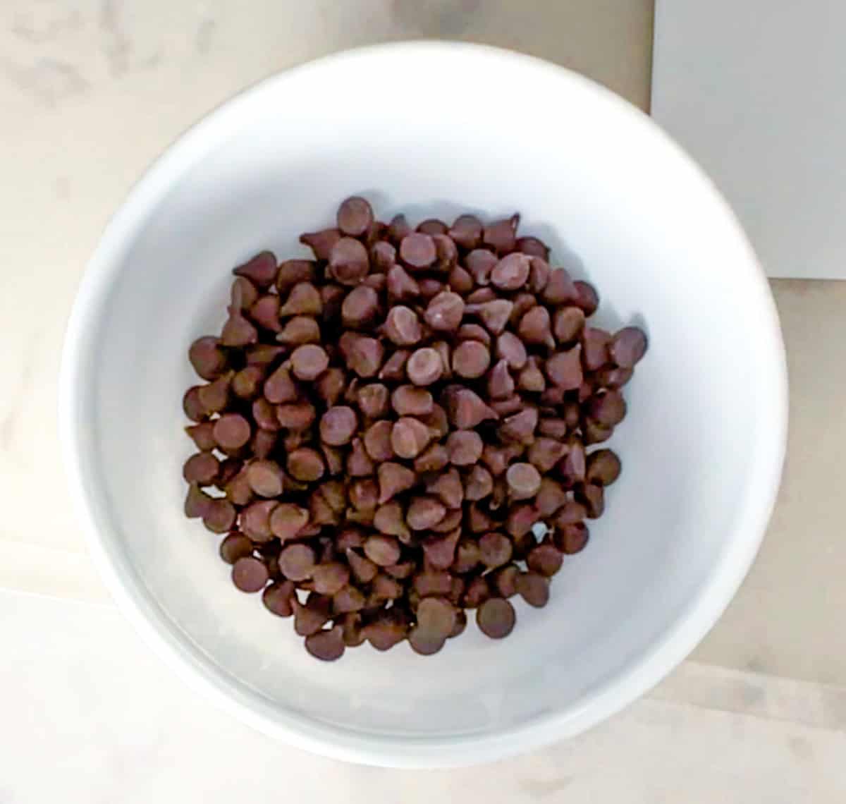 bowl of sugar free chocolate chips ready to be melted.