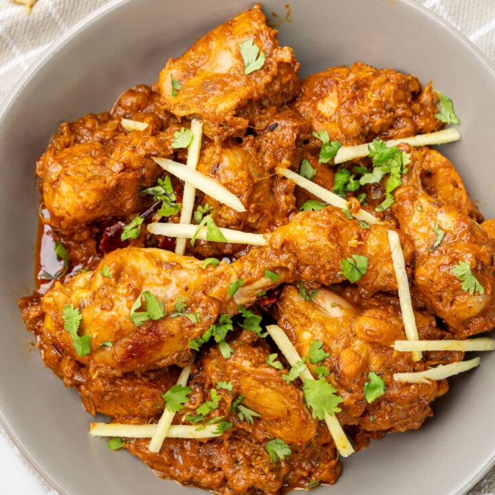 pieces of masala chicken in a bowl.