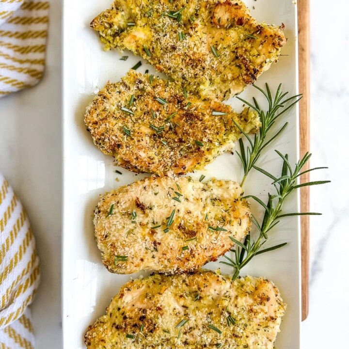 4 pieces of breaded chicken on a plate.
