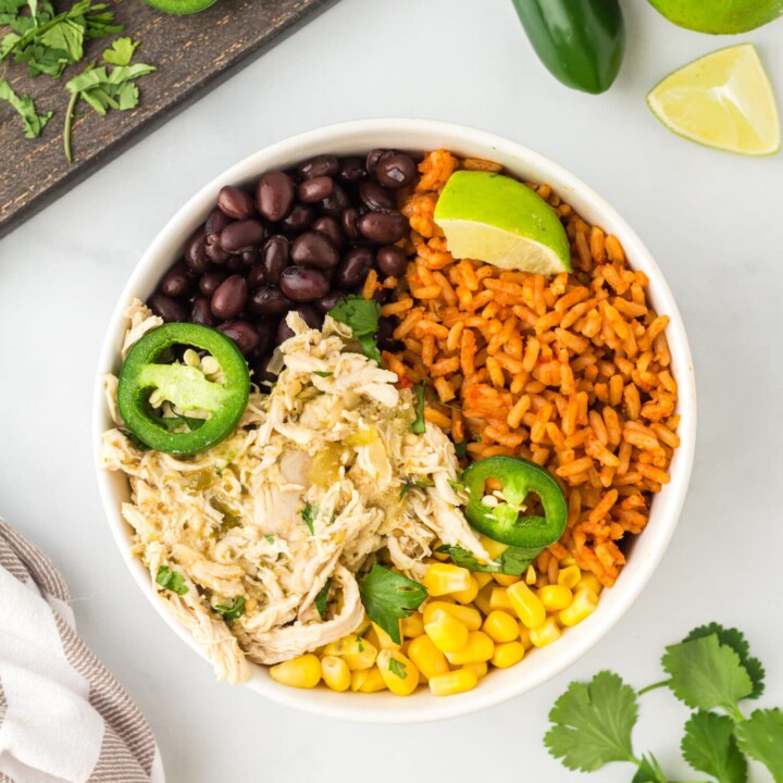 bowl with shredded chicken, corn, black beans, and spanish rice.