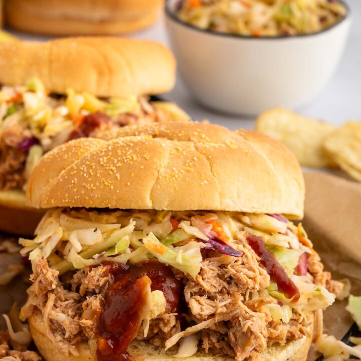 shredded barbecue chicken on a roll.