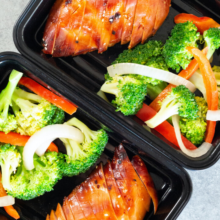 sliced chicken breasts and broccoli in meal prep containers.