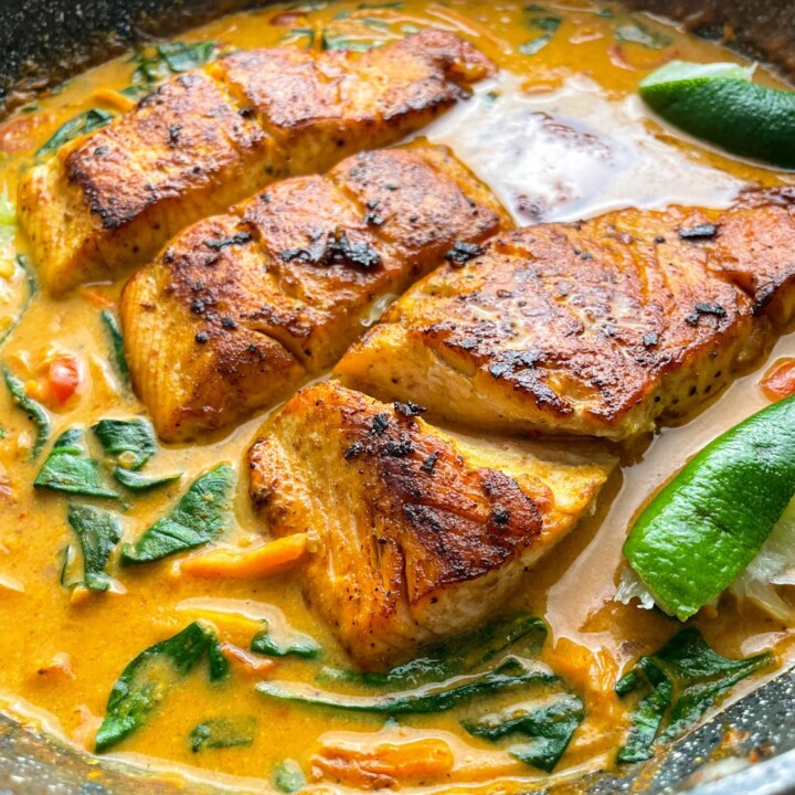 coconut curry salmon in a skillet.