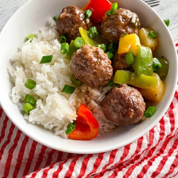 bowl with sweet and sour meatballs and rice.