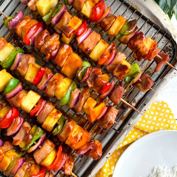 pork and pineapple kebabs with vegetables on skewers.