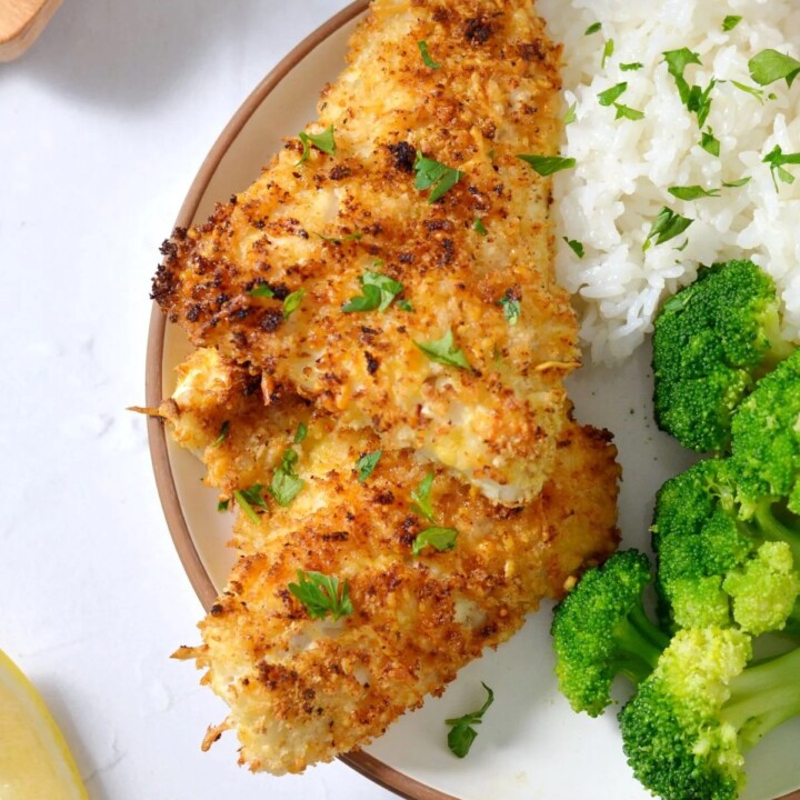 plate with air fryer walleye with steamed broccoli and white rice.
