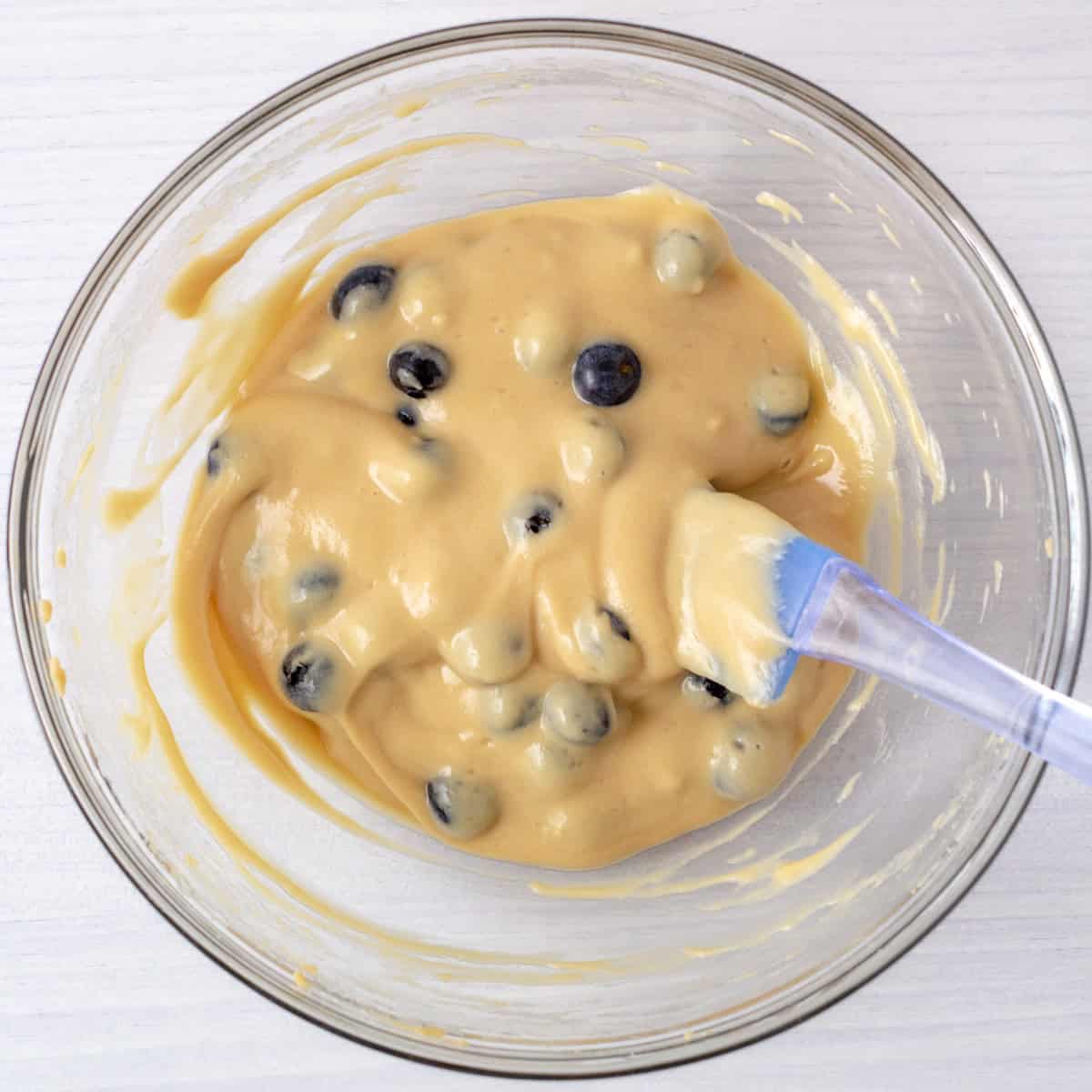 bowl of blueberry protein pancake batter ready for the griddle.