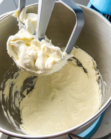 whipped cream cheese in a mixer for the protein mini cheesecakes.