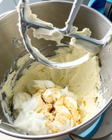 whipped cream cheese with yogurt and vanilla in a mixer for the protein mini cheesecakes.
