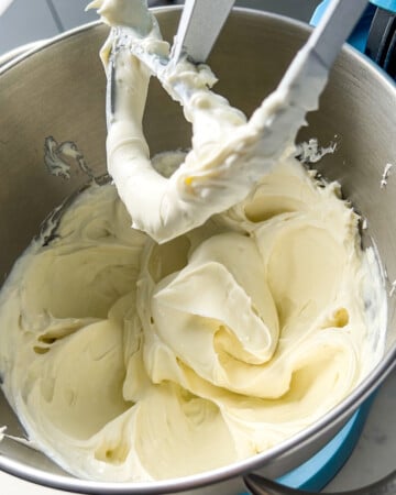 whipped cream cheese with yogurt and vanilla in a mixer for the protein mini cheesecakes.