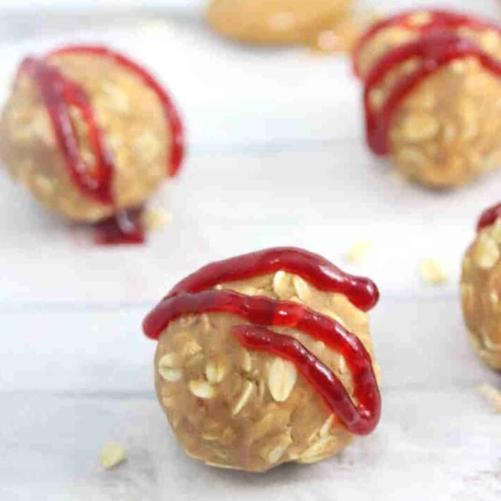 peanut butter protein balls drizzled with raspberry jam.
