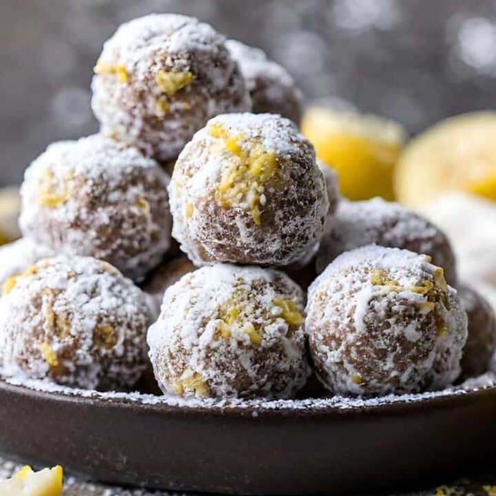lemon bar protein balls piled on a small plate.
