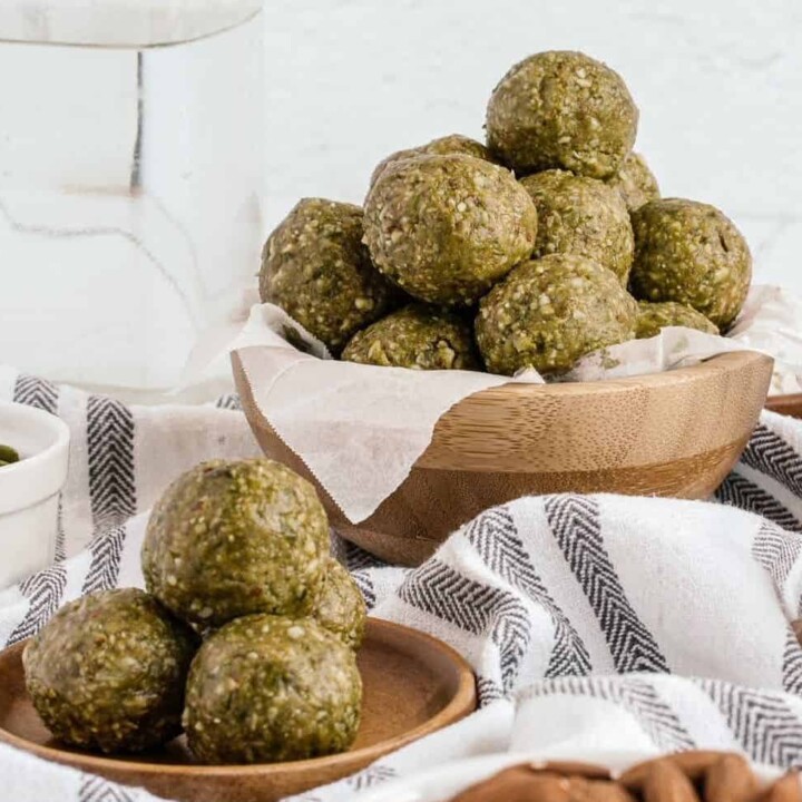 matcha protein balls in a bowl and on a plate.