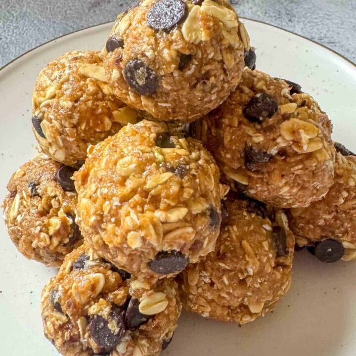 pile of protein balls with oatmeal, honey, peanut butter, and chocolate chips.