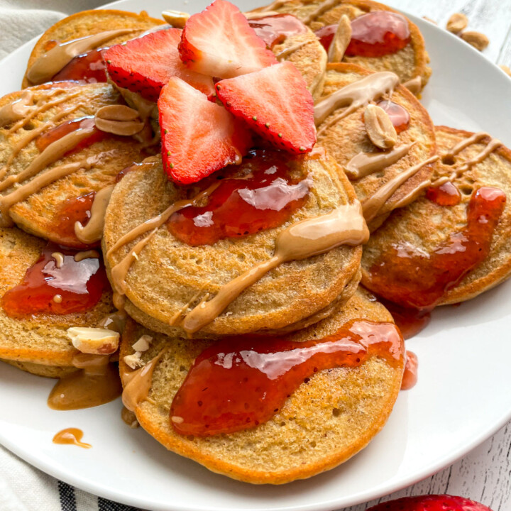 plated protein pancakes with strawberry sauce.
