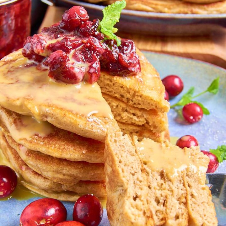 cut stack of protein pancakes with cranberries.